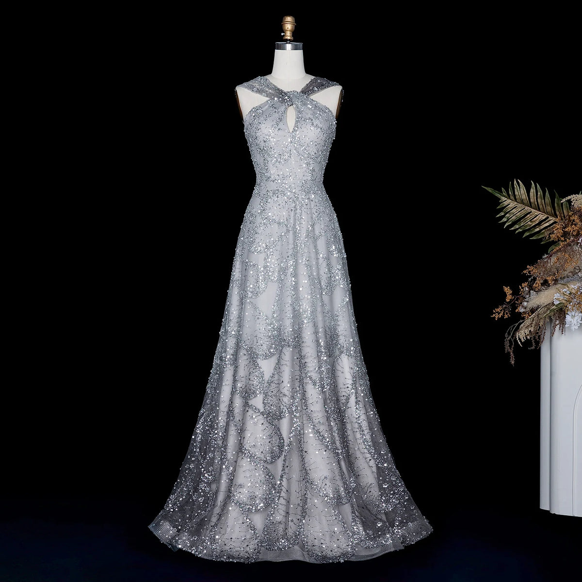 Robe de soirée trapèze perlée et croisée – CLEVI Paris