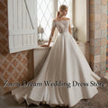 Robe de mariée satinée ligne A épaules dénudées – CLEVI Paris