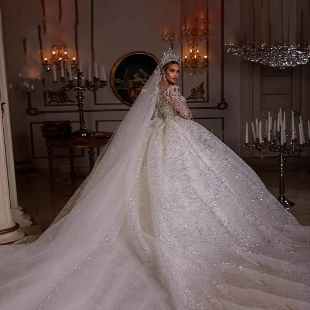 Robe de mariée en tulle col V manches longues – CLEVI Paris
