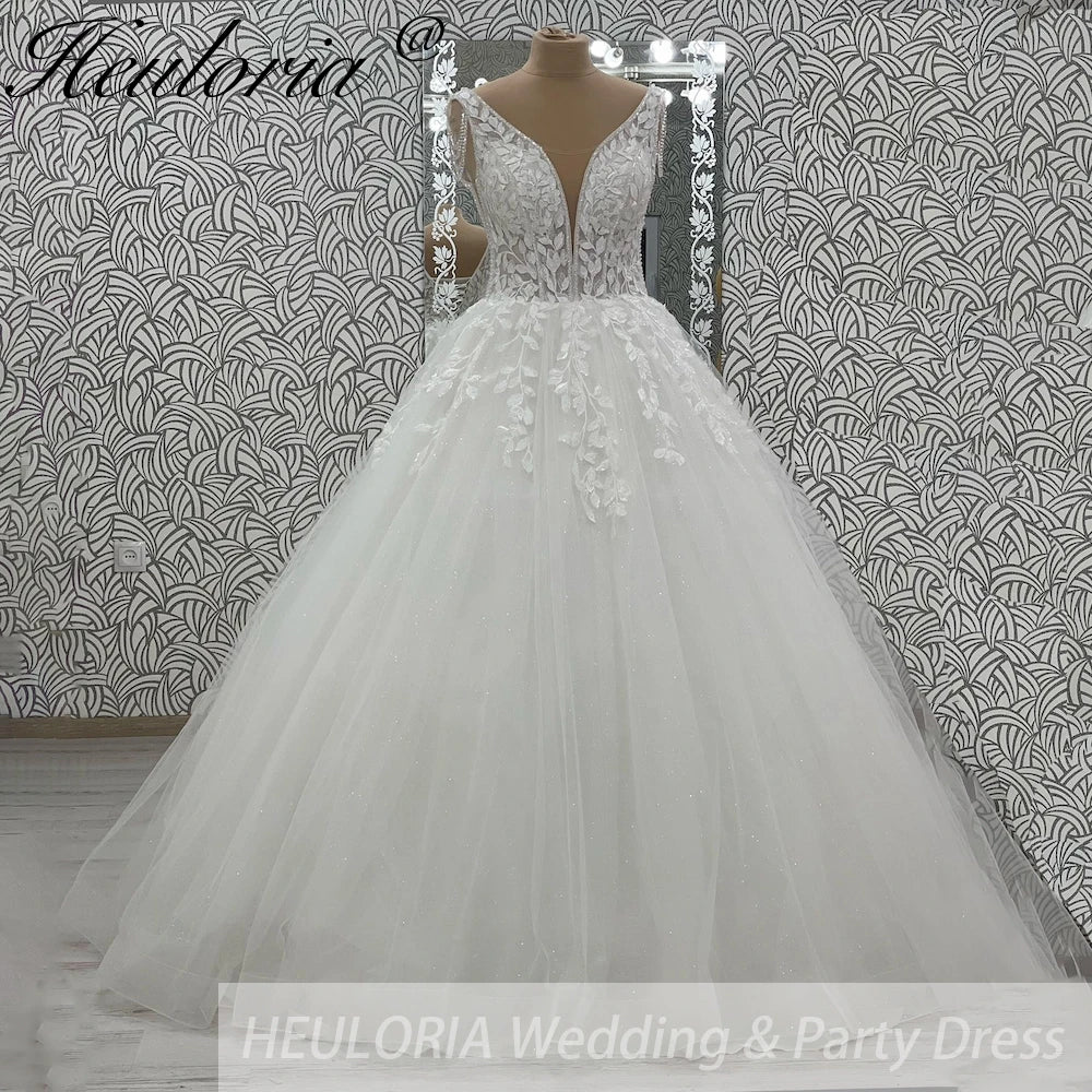Robe de mariée ligne A en dentelle à perles – CLEVI Paris