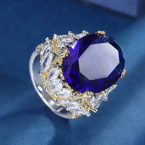 Bague Cocktail Femme Huitan A257 – Zircone Cubique Ovale Bleue Bicolore Tendance